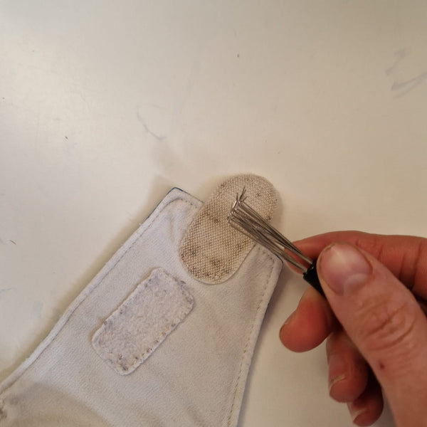 Leva pelucchi per strappi dei pannolini