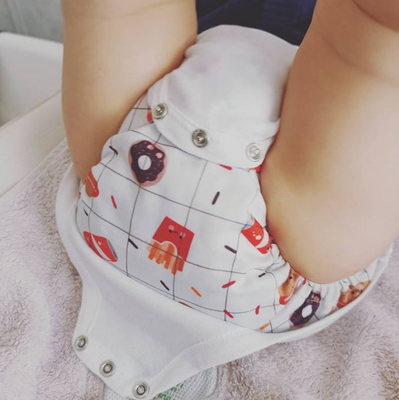 È meglio acquistare un body di taglia superiore per i miei pannolini lavabili?